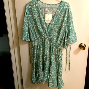 Dress, falls beneath the knees.